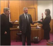  ??  ?? Marissa Booth, of Nicholson, Wyoming County, takes her oath of office as a Montgomery County prosecutor.