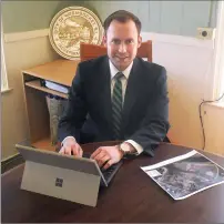  ?? Photo by Ernest A. Brown ?? Blake Collins works in his office at Woonsocket City Hall Friday.