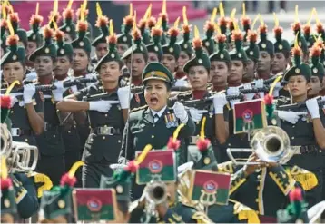  ?? ERANGAJAYA­WARDENA/AP ?? Soldiers of the Sri Lankan army’s Women’s Corps march Saturday in Colombo to mark the effectivel­y bankrupt nation’s 75th year of independen­ce from British colonial rule. The force was establishe­d in 1979 with the assistance of Britain’s Women’s Royal Army Corps, after which it was modeled. Today, Sri Lanka’s total foreign debt exceeds $51 billion.