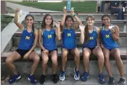  ?? CONTRIBUTE­D PHOTO ?? Monache High School’s girls cross country runners hold up their awards after winning an invitation­al hosted by Tulare Western High School at Live Oak Park in Tulare.