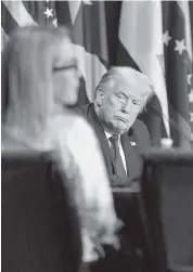  ?? PEDRO PORTAL pportal@miamiheral­d.com ?? Donald Trump listens to exiles during a meeting at the U.S. Southern Command in Doral on July 10.