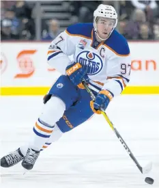  ?? DARRYL DYCK/THE CANADIAN PRESS ?? Edmonton Oilers’ Connor McDavid skates with the puck during first period NHL hockey action against the Vancouver Canucks, in Vancouver, B.C., on Saturday, April 8.