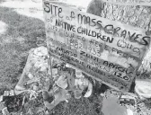  ?? SUSAN MONTOYA BRYAN/AP 2021 ?? A makeshift memorial for dozens of Indigenous children who died while attending a boarding school is displayed in Albuquerqu­e, N.M.