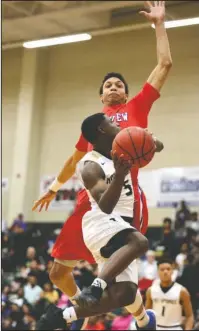  ?? Arkansas Democrat-Gazette/Thomas Metthe ?? PATRIOT PRESSURE: Little Rock Parkview’s Ethan Henderson, back, jumps to attempt to block the shot of Hot Springs freshman J.J. Walker (5) during the first quarter of Parkview’s 52-39 win Saturday in the Class 5A state semifinal at Maumelle High School.