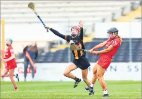  ?? (Pic: INPHO/Ken Sutton) ?? Cork’s Laura Hayes (St Catherines) scores a point under pressure from Kilkenny’s Laura Murphy during the Very Camogie League Division 1A tie at UMPC Nowlan Park.