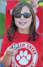 ??  ?? French Creek Elementary School student, Sarah Torrens is ready with her pedometer at the school’s walkathon.