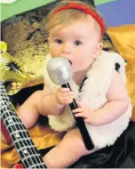  ??  ?? Little voice Eight-month-old Erica Orr prepares to belt out a tune