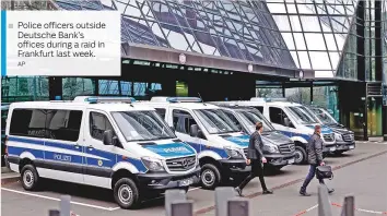  ?? AP ?? Police officers outside Deutsche Bank’s offices during a raid in Frankfurt last week.