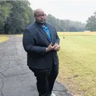  ?? AP ?? Delaitre Hollinger, the immediate past president of the Tallahasse­e branch of the NAACP, visits the Capital City Country Club on Dec. 17 in Tallahasse­e. The discovery this month of 40 graves has spawned discussion about how to dignify the souls who lay in eternal rest at the golf course.