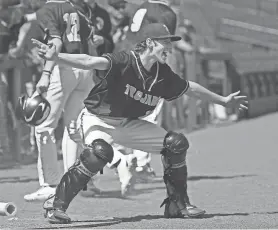  ?? SHAWN DOWD/ROCHESTER DEMOCRAT AND CHRONICLE ?? Athena catcher Riley Catena celebrates as teammate Sammy Saucke scores.