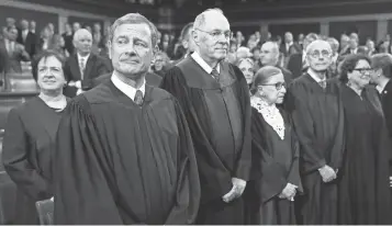  ?? EVAN VUCCI, AP ?? Ruth Bader Ginsburg and her fellow Supreme Court justices gather for President Obama’s State of the Union address Jan. 12. Ginsburg has been on the court more than 23 years.