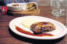  ??  ?? Pork ribs with mashed potatoes.