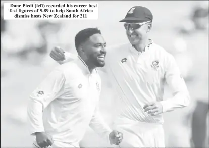  ?? ?? Dane Piedt (left) recorded his career best Test figures of 5-89 to help South Africa dismiss hosts New Zealand for 211