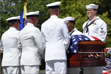  ?? DAVID DERMER — THE ASSOCIATED PRESS ?? Members of the U.S. Navy Honor Guard transport the casket of Navy Corpsman Maxton Soviak at Morman-HinmanTann­er Funeral Home Sept. 8 in Berlin Heights. Soviak was one of 13 U.S. troops killed Aug. 26 in a horrific suicide bombing at Afghanista­n’s Kabul airport.