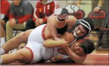  ?? GENE WALSH — DIGITAL FIRST MEDIA ?? North Penn’s Ryan Cody, wrestling Souderton’s James Plumly on Wednesday, Jan. 24, 2018, tries to defend his 285 title at the District 1-AAA East Tournament Saturday.