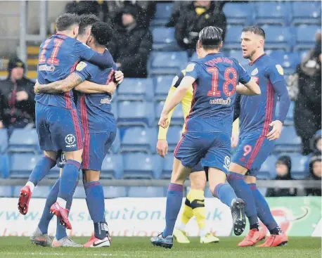  ??  ?? Sunderland players celebrate a goal against Oxford United last season.