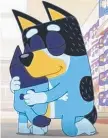  ?? ?? Bandit hugs Bluey.