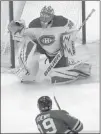  ?? Nam Y. Huh The Associated Press ?? Canadiens goalie Charlie Lindgren catches a shot by Blackhawks center Jonathan Toews in the third period of Sunday’s game.