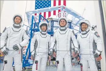  ?? SPACEX ?? The SpaceX crew for a trip to the Internatio­nal Space Station at the SpaceX training facility in Hawthorne. From left are mission specialist Thomas Pesquet of the European Space Agency, pilot Megan McArthur and commander Shane Kimbrough of NASA, and mission specialist Akihiko Hoshide of the Japan Aerospace Exploratio­n Agency.