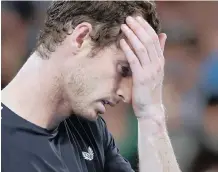  ?? REUTERS/LUCY NICHOLSON ?? Andy Murray looks dejected after losing his match against Spain’s Roberto Bautista Agut. |