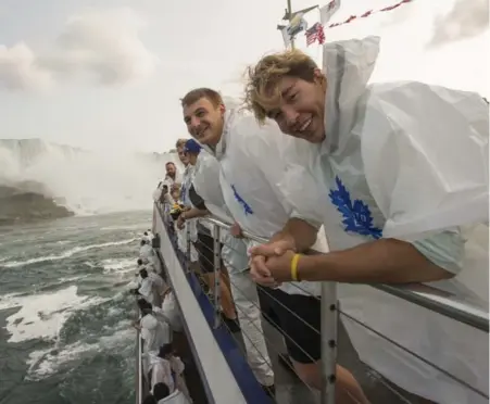  ?? RICK MADONIK/TORONTO STAR ?? A few of the Leafs took advantage of a weekend training camp in Niagara Falls by getting an up-close look at the tourist attraction. From right to left: Rinat Valiev, Zach Hyman, Connor Carrick (head turned), and William Nylander.