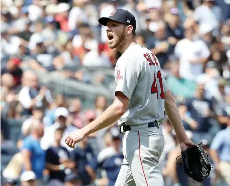  ?? ASSOCIATED PRESS ?? FRUSTRATIN­G DAY: Chris Sale has words for home plate umpire Mike Estabrook as he leaves in the fourth inning of the Red Sox’ 9-2 loss to the Yankees in yesterday's Game 1 of a doublehead­er. The Sox also lost the nightcap, 6-4.