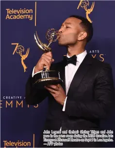  ??  ?? John Legend and (below) Chrissy Teigen and John pose in the press room during the 2018 Creative Arts Emmys at Microsoft Theatre on Sept 9 in Los Angeles. — AFP photos