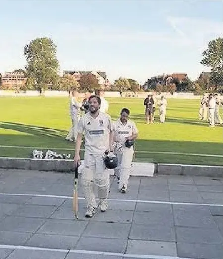  ?? Andy Warhurst and Chris Firth leave the field after S&B’s promotion to the Premier Division Angus Matheson ??