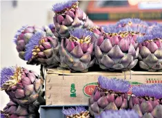  ??  ?? Colourful artichokes adorn a market stall in Rennes, Ille-et-vilaine, Brittany, France