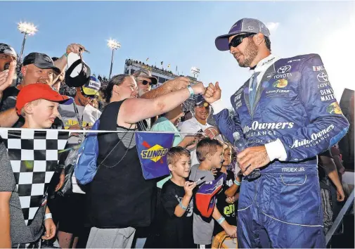  ?? PETER CASEY, USA TODAY SPORTS ?? Martin Truex Jr., being introduced Sept. 4 at Darlington Raceway, says of New Hampshire Motor Speedway, “There’s no other track I’d rather win at right now.”