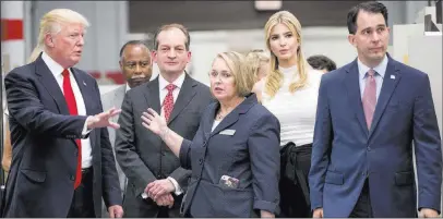  ?? Andrew Harnik ?? The Associated Press President Donald Trump, Labor Secretary Alexander Acosta, third from left, Ivanka Trump, second from right, and Wisconsin Gov. Scott Walker, right, tour the Waukesha County Technical College in Pewaukee, Wis., on Tuesday.