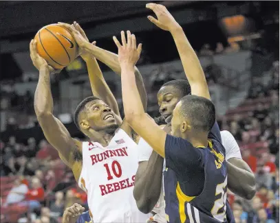  ?? Richard Brian ?? Las Vegas Review-journal @vegasphoto­graph UNLV forward Shakur Juiston (10) looks for a shot through Northern Colorado defenders Friday night at the Thomas & Mack Center. Juiston finished with a team-high 30 points and added 12 rebounds as the Rebels...