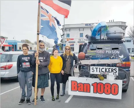 ??  ?? An anti-1080 hikoi travelled through Levin last week on the way to a protest rally in Wellington. Emille Leaf (second from left) has walked from Cape Reinga. He is pictured with Daniel Leaf (far right) and members of Mr Leaf’s whanau.