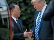  ?? THE ASSOCIATED PRESS ?? President Donald Trump shakes hands with Kim Yong Chol, former North Korean military intelligen­ce chief and one of leader Kim Jong Un’s closest aides, as after their meeting in the Oval Office of the White House in Washington Friday.