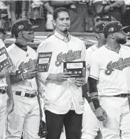  ?? Gregory Shamus / Getty Images ?? Carlos Carrasco, center, has received an outpouring of support since announcing his cancer diagnosis.