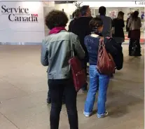  ?? RYAN REMIORZ/THE CANADIAN PRESS. ?? People wait for the Service Canada employment centre to open in Montreal.