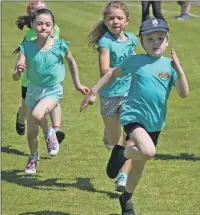  ?? t24rockfie­ld01 (KM) ?? These Rockfield youngsters are totally focused as they head for the finish line in the 60m race.