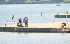  ??  ?? Beachgoers enjoy the water Thursday at Chester Frost Park.