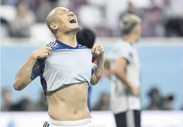  ?? ?? ↑ Celtic striker Daizen Maeda, who led the line for Japan in Doha yesterday before being substitute­d, shows his frustratio­n after seeing his first-half ‘goal’ ruled out for offside