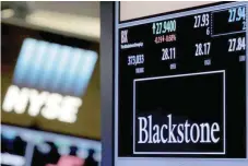  ?? — Reuters ?? The ticker and trading informatio­n for Blackstone Group is displayed at the post where it is traded on the floor of the New York Stock Exchange.