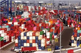  ?? Photograph: Mario Tama/Getty Images ?? Shipping containers are stacked at the Port of Los Angeles in San Pedro, California.