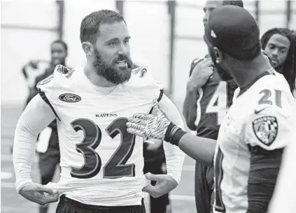  ?? KENNETH K. LAM/BALTIMORE SUN ?? Eric Weddle, left, talks with fellow safety Lardarius Webb during organized team activities in June. Webb recalls that he told his newly arrived teammate, “We want Eric Weddle. Don’t hold back. Don’t be quiet. We want you. … Just be yourself. ”