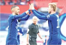  ??  ?? Chelsea’s Moroccan midfielder Hakim Ziyech (left) celebrates with Chelsea’s German striker Timo Werner after scoring the opening goal of the English FA Cup semi-final football on Saturday. - AFP photo