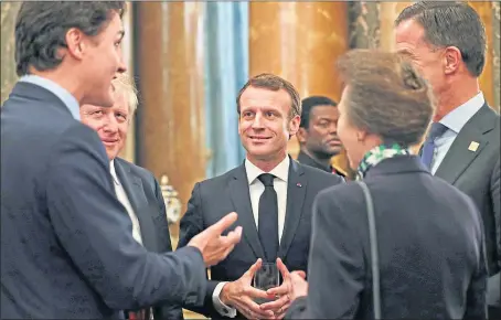  ??  ?? Justin Trudeau, left, with Boris Johnson, Emmanuel Macro, Jens Stoltenber­g, and Princess Anne, caught poking fun at US President Donald Trump at Buckingham Palace