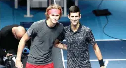 ??  ?? Alexander Zverev, left, and Novak Djokovic