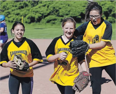  ?? CLIFFORD SKARSTEDT CLIFFORD SKARSTEDT/EXAMINER ?? Lakefield Tigers players celebrate against James Strath during Three-Pitch, Kawartha Pine Ridge Elementary Athletic Associatio­n North Intermedia­te Girls' Tournament action at Bowers Park on Friday.