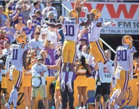  ?? SCOTT CLAUSE/USA TODAY NETWORK ?? LSU wide receivers Jaray Jenkings (10) and Malik Nabers celebrate during the team's defeat of Florida at Tiger Stadium in Baton Rouge.
