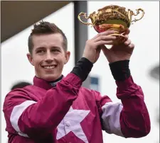  ??  ?? 2016: Bryan Cooper celebrates with the Gold Cup after winning the Timico Cheltenham Gold Cup Steeple Chase on Don Cossack