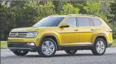  ??  ?? The 2018 Volkswagen Atlas, left, is the company’s first attempt at a full-size, three-row SUV. It’s not a design triumph. The 2018 Toyota Highlander, right, continues its long run in the U.S., and is surprising­ly about the same size as the Atlas.