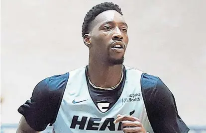  ?? MIAMI HEAT COURTESY ?? Bam Adebayo was back on the move for the Heat on Tuesday at Disney. Adebayo scored 16 points but the Grizzlies beat the Heat by 18.